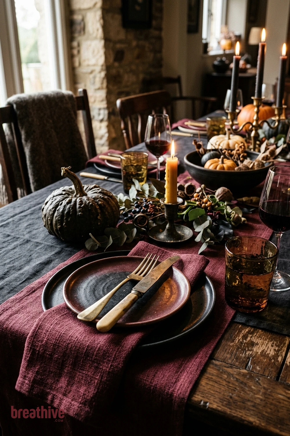 dinner party Halloween dining room idea with close-up of ceramics, glass, textiles, wood, metal, and seasonal texture