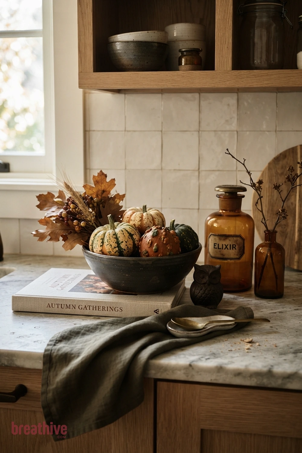 counter styling Halloween kitchen counter idea with close-up of ceramics, glass, textiles, wood, metal, and seasonal texture