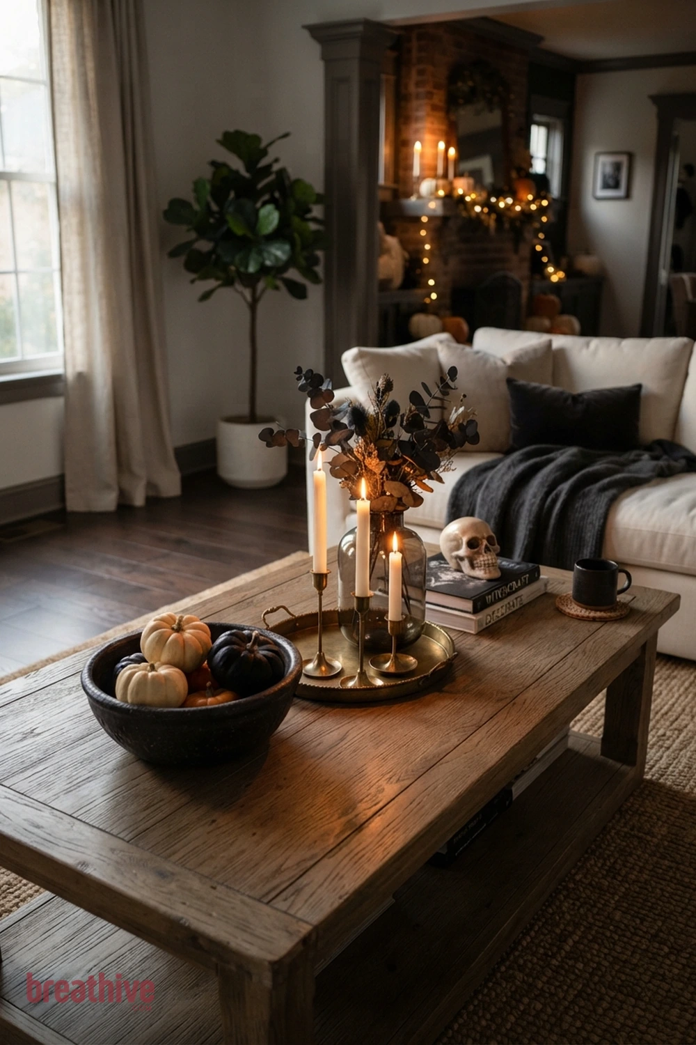 candlelit Halloween living room idea with coffee table vignette that leaves usable surface space around seasonal decor