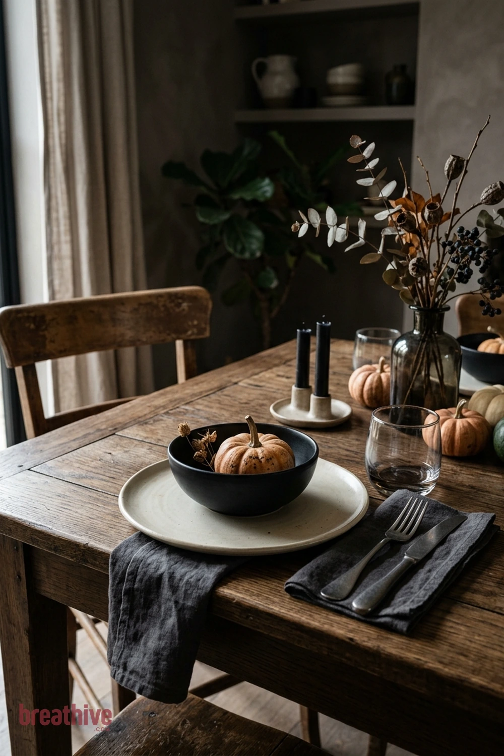 minimalist dining Halloween dining room idea with close-up of ceramics, glass, textiles, wood, metal, and seasonal texture