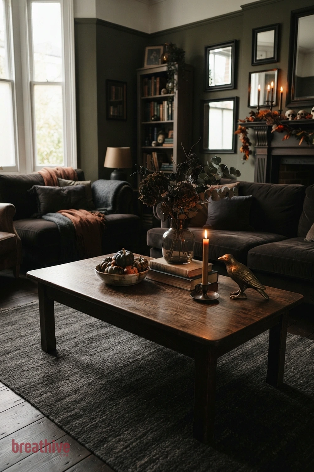 moody Halloween living room idea with coffee table vignette that leaves usable surface space around seasonal decor