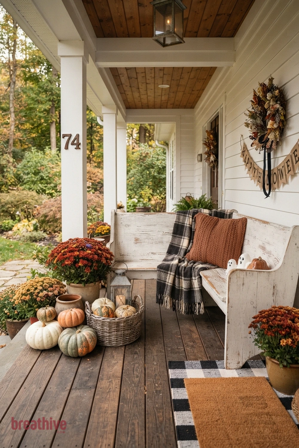 farmhouse Halloween front porch idea with usable bench or chair corner with seasonal layers that do not crowd sitting space