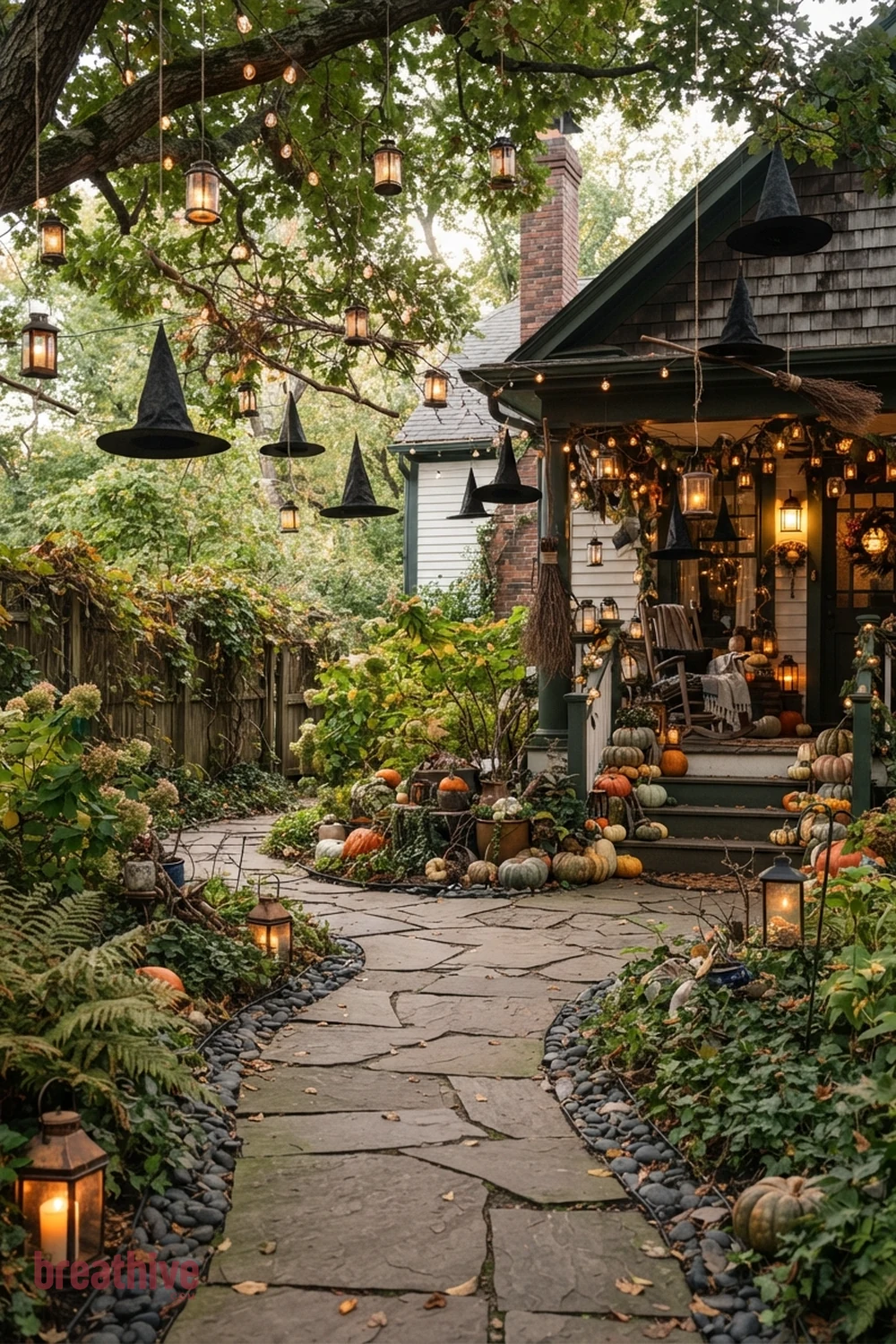 whimsical witch Halloween porch and walkway idea with garden bed, tree, fence, or lawn edge with seasonal decor integrated into existing landscape