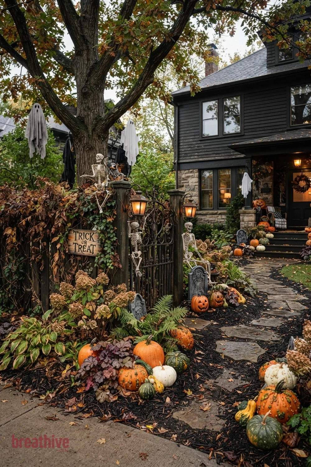 spooky aesthetic Halloween front yard idea with garden bed, tree, fence, or lawn edge with seasonal decor integrated into existing landscape
