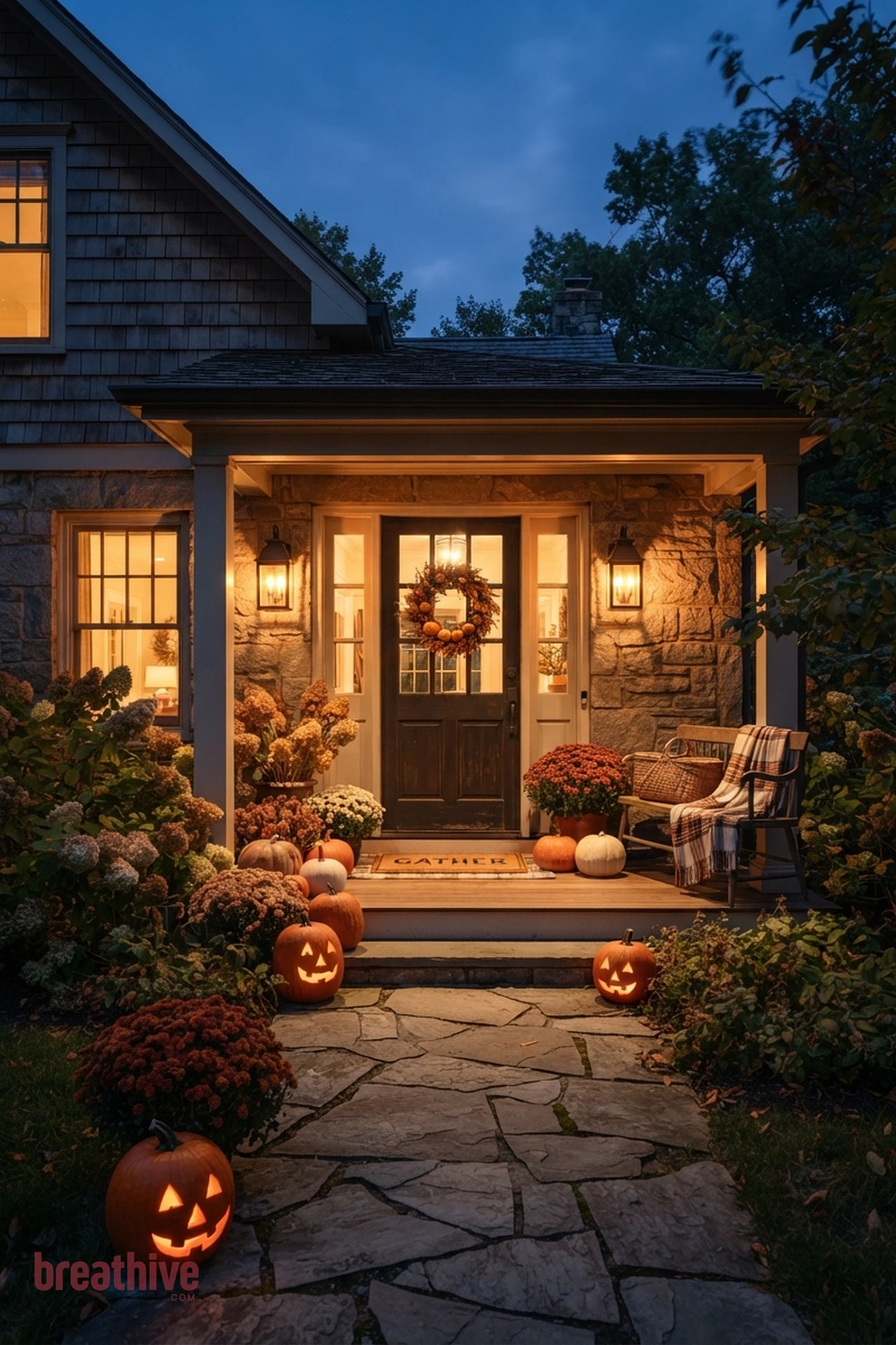 cozy Halloween front entry idea with same entry transformed after dusk through layered practical lighting