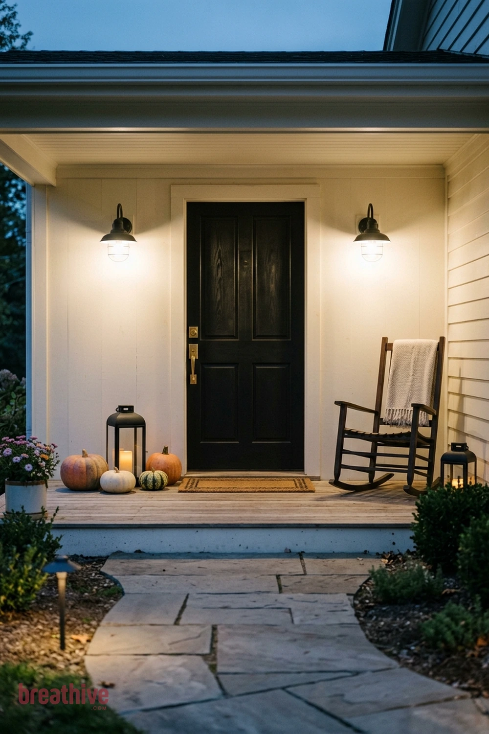 minimalist Halloween front porch idea with same entry transformed after dusk through layered practical lighting