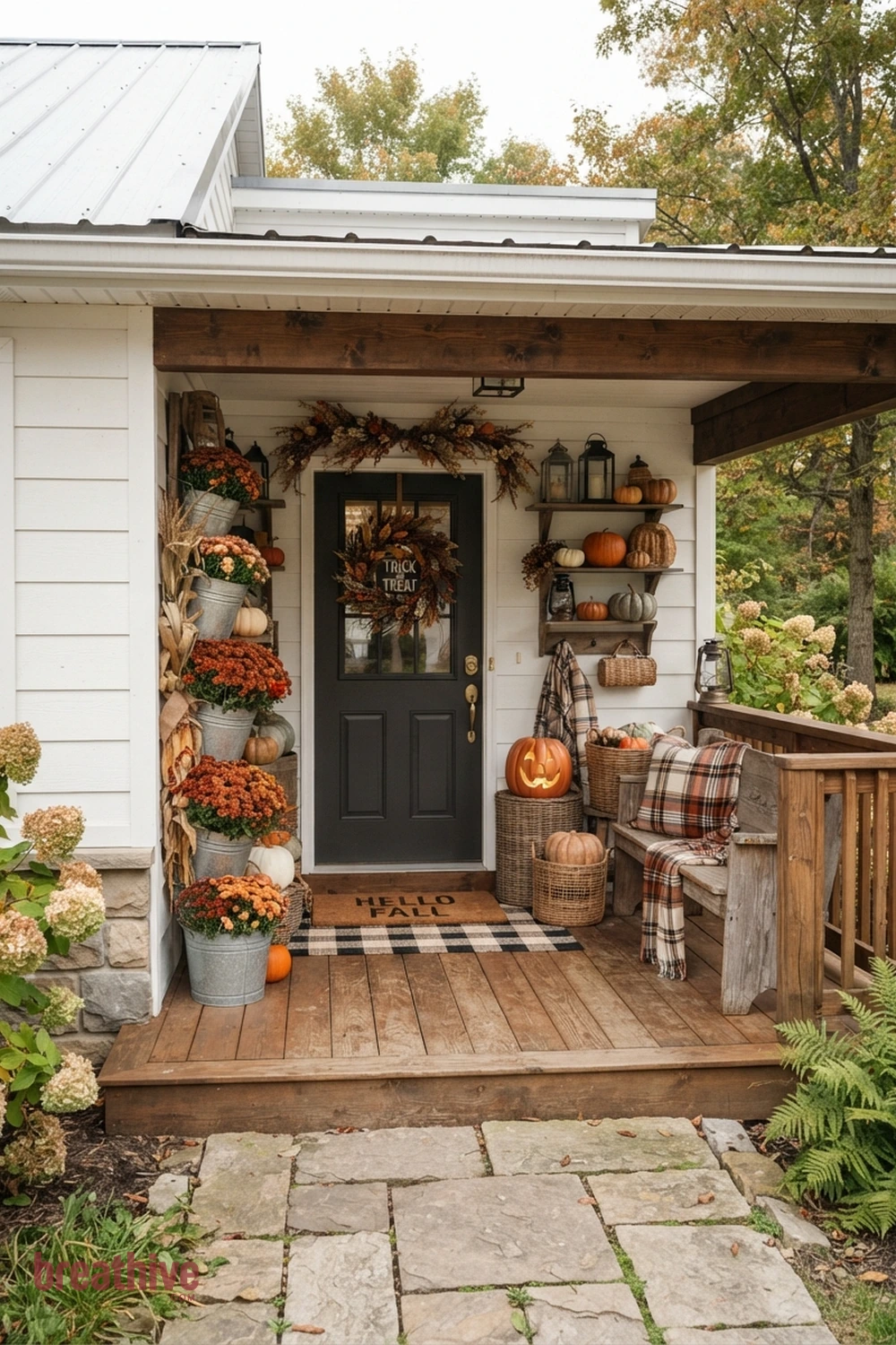 farmhouse Halloween front porch idea with compact entry using vertical or grouped decor instead of spreading across the floor