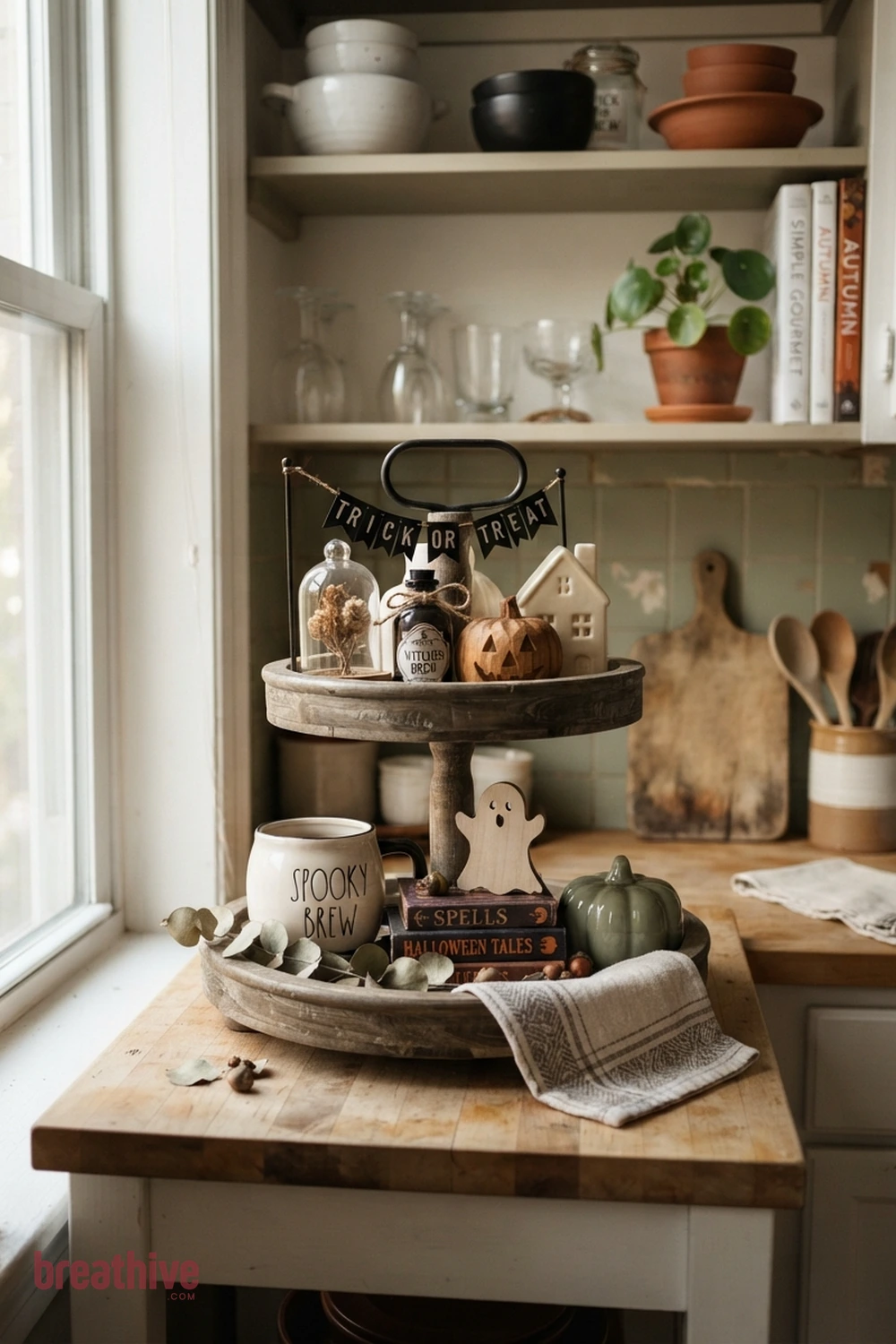 tiered tray Halloween kitchen counter idea with compact apartment kitchen, breakfast nook, or narrow counter using a restrained seasonal grouping