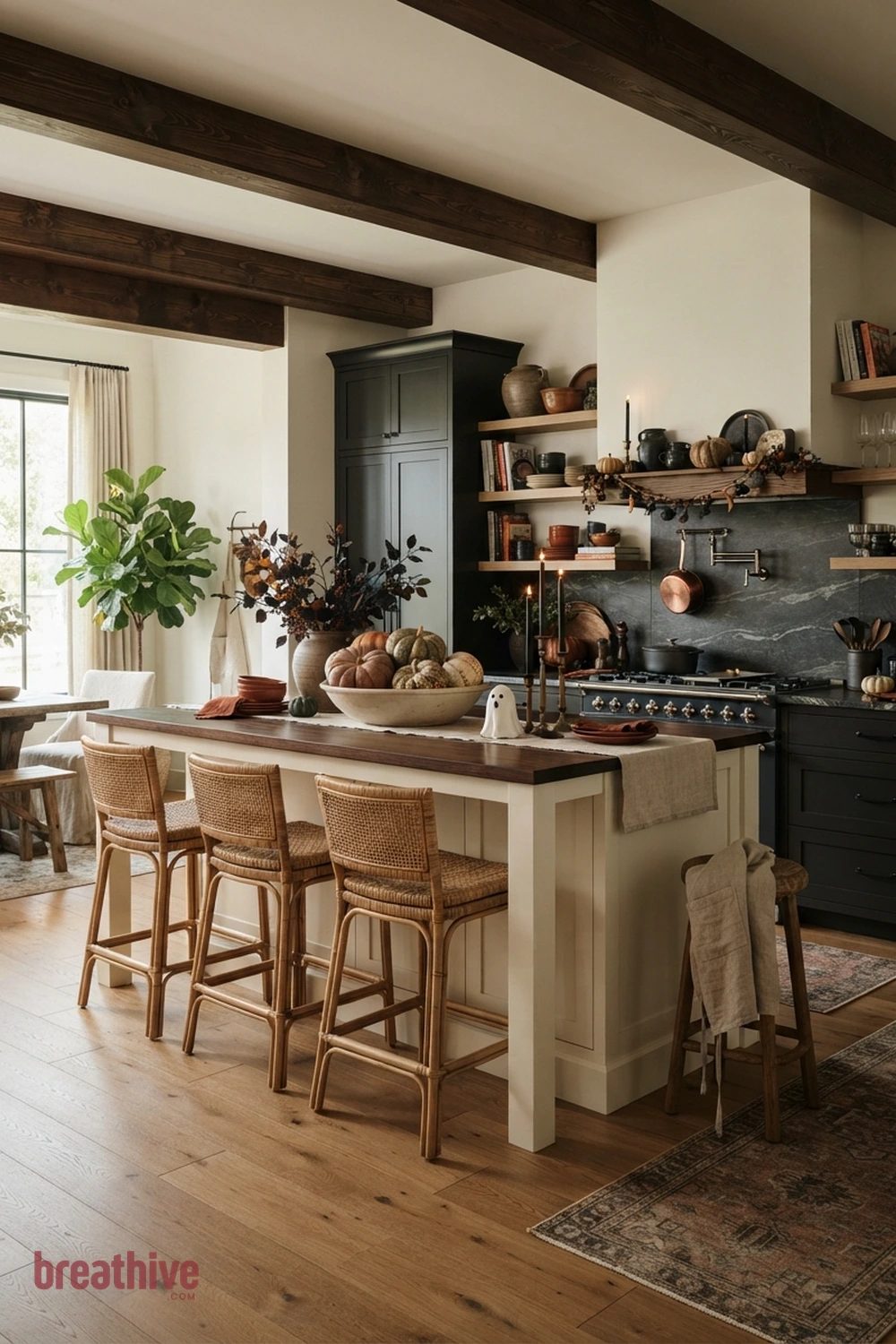 island-focused Halloween kitchen idea with second angle revealing circulation, seating clearance, and how decorative color repeats