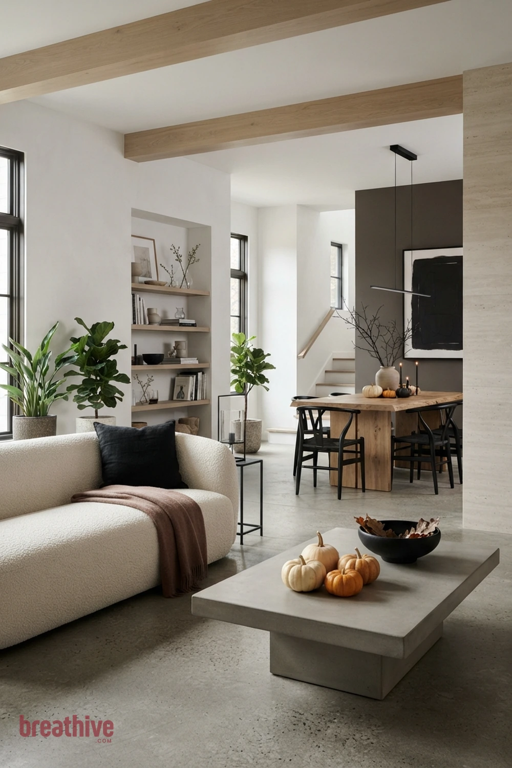 modern minimalist Halloween living room idea with second room angle revealing circulation, scale, and how seasonal accents repeat through the space