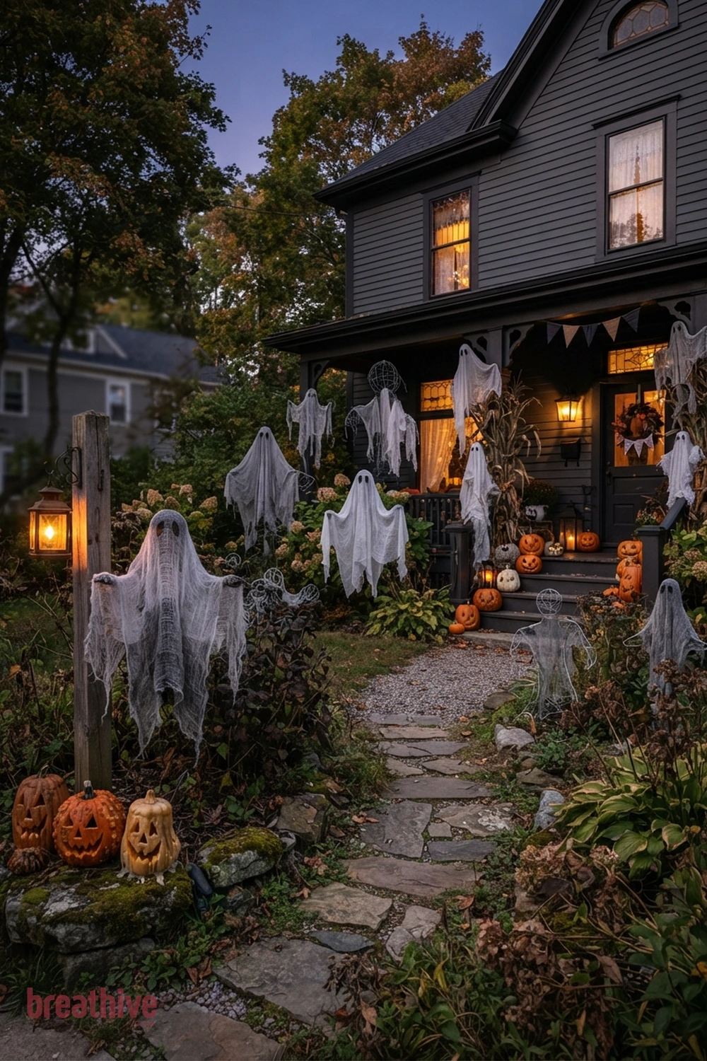 ghost-themed Halloween front yard idea with foreground, middle-ground, and background seasonal elements creating depth without clutter