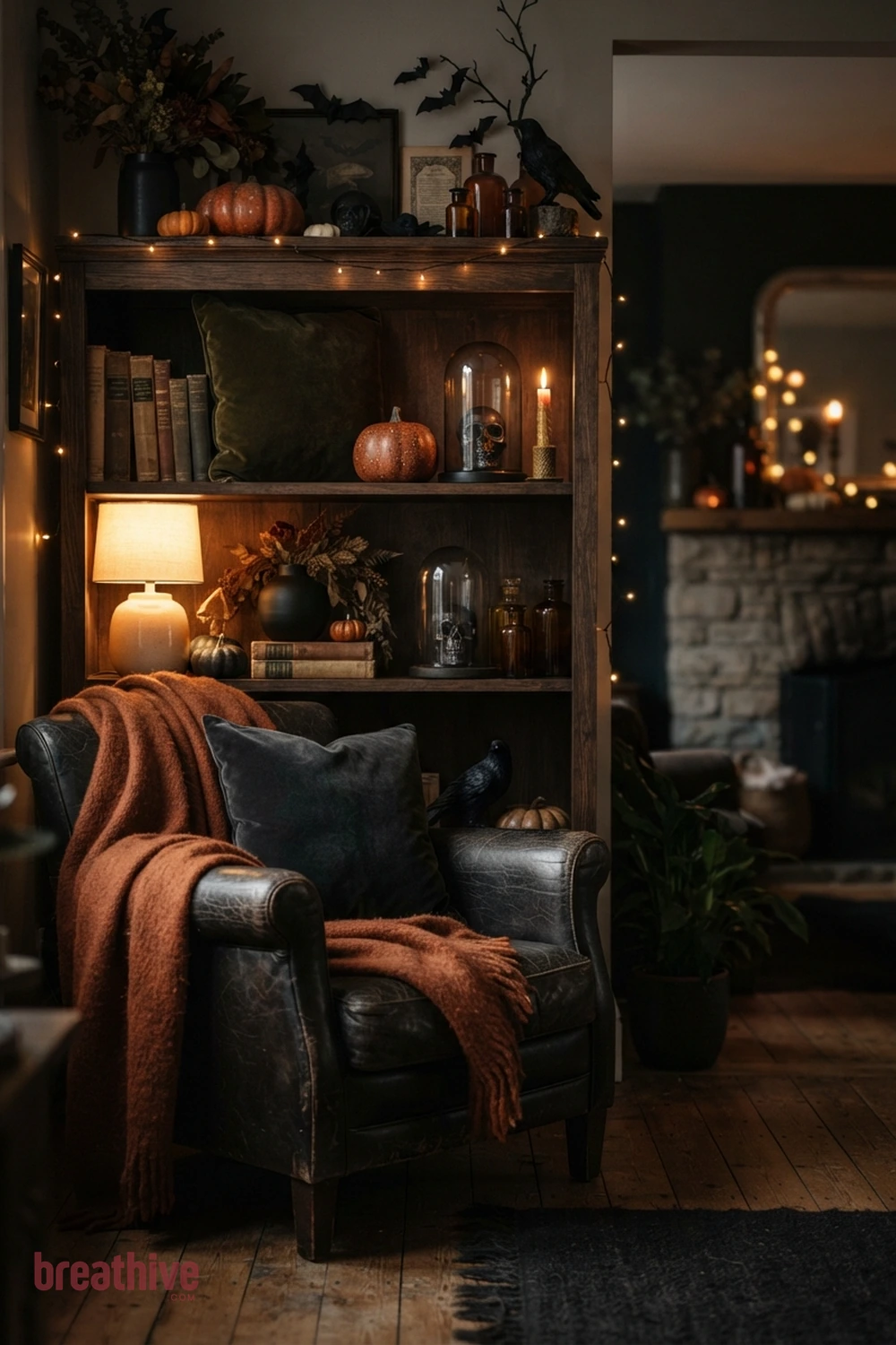 moody Halloween living room idea with focused vignette that demonstrates color repetition and controlled decorative density